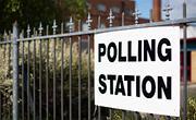 Elections Polling station sign on a fence