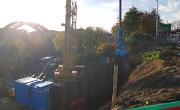 Construction of the retaining wall on Dame Dorothy Street to facilitate future road widening. Sheet piles are being pushed 13 metres into the ground to support the widened road.