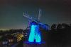 Fulwell Mill lit up blue